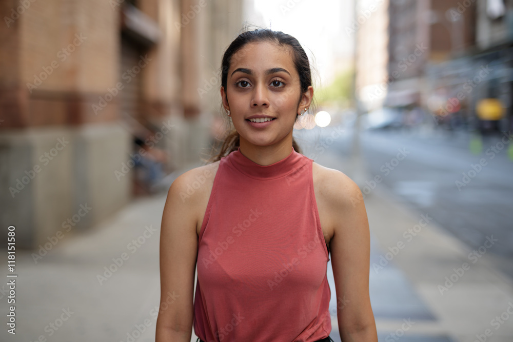 Young woman in city walking smile happy face