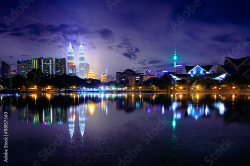 Night view of kuala lumpur city with reflection in water