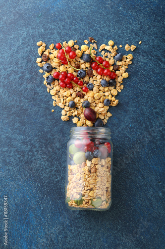 Ingrediets for healthy breakfast in glass jar photo