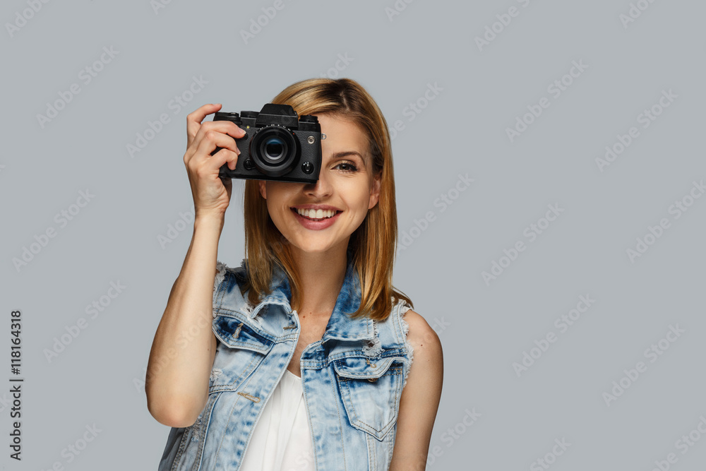 Portrait of blond female photographer. Portrait of blond female photographer.