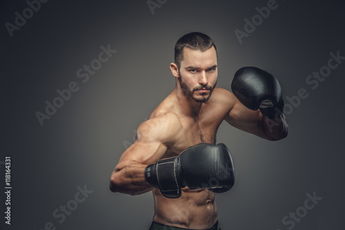 Male fighter in boxing gloves.