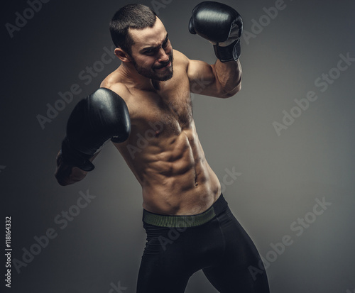 Male fighter in boxing gloves. © Fxquadro