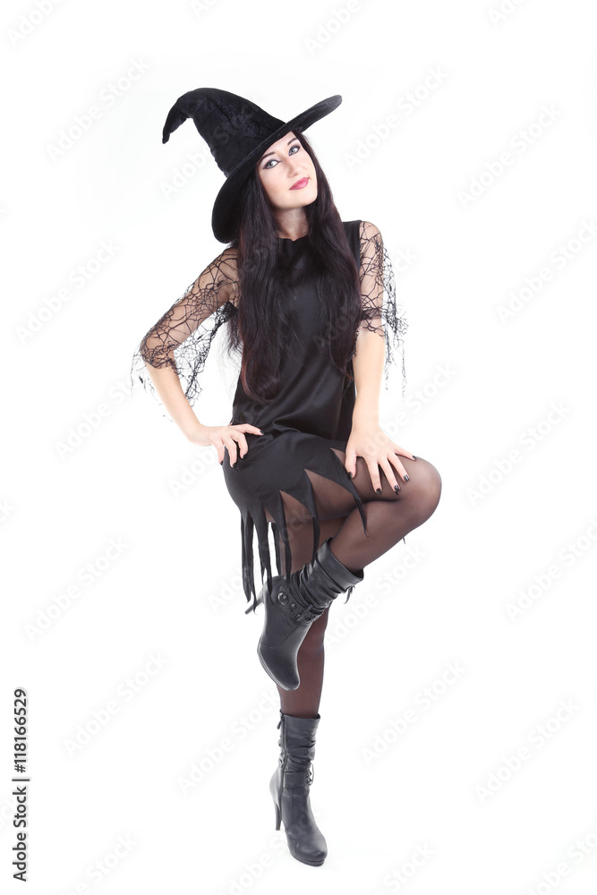 Young brunette witch isolated on a white