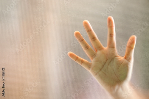 Hand on frosted glass