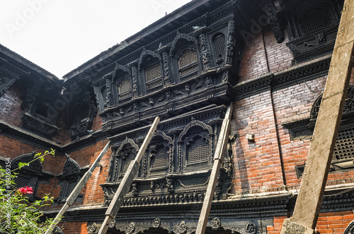 Stunning architecture in the Kumari Ghar temple of the living goddess Kumari Devi after major earthquake in 2015, Kathmandu, Nepal - The Kumari Ghar houses the Kumari Devi in Kathmandu, Nepal photo