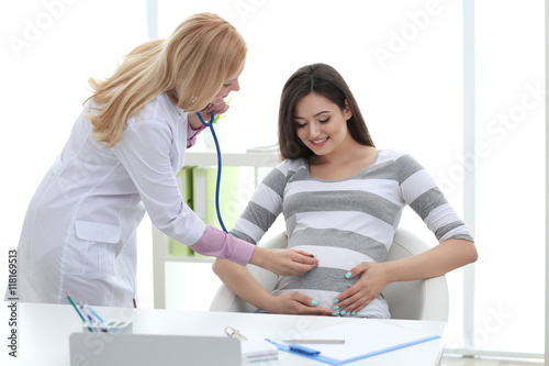 Young pregnant woman with d...