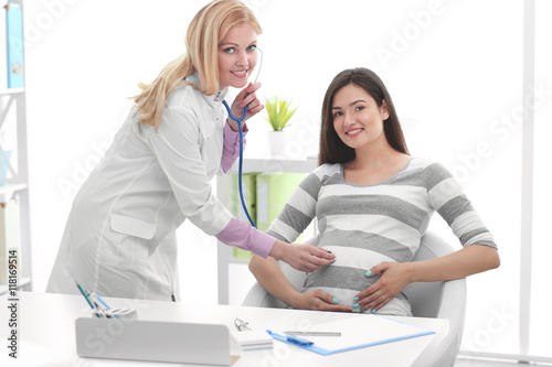 Young pregnant woman with d...