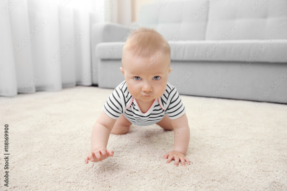 Adorable little baby crawling on light carpet Adorable little baby crawling on light carpet
