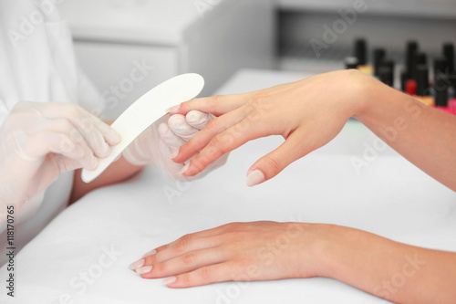 Woman getting a manicure in a beauty salon  close up