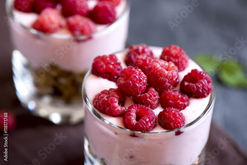 parfait dessert with raspberries and granola