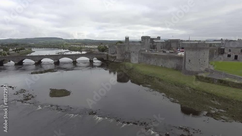 King John castle and thomond bridge in Limerick - Ireland - Famous Limerick Public tourist attraction. photo