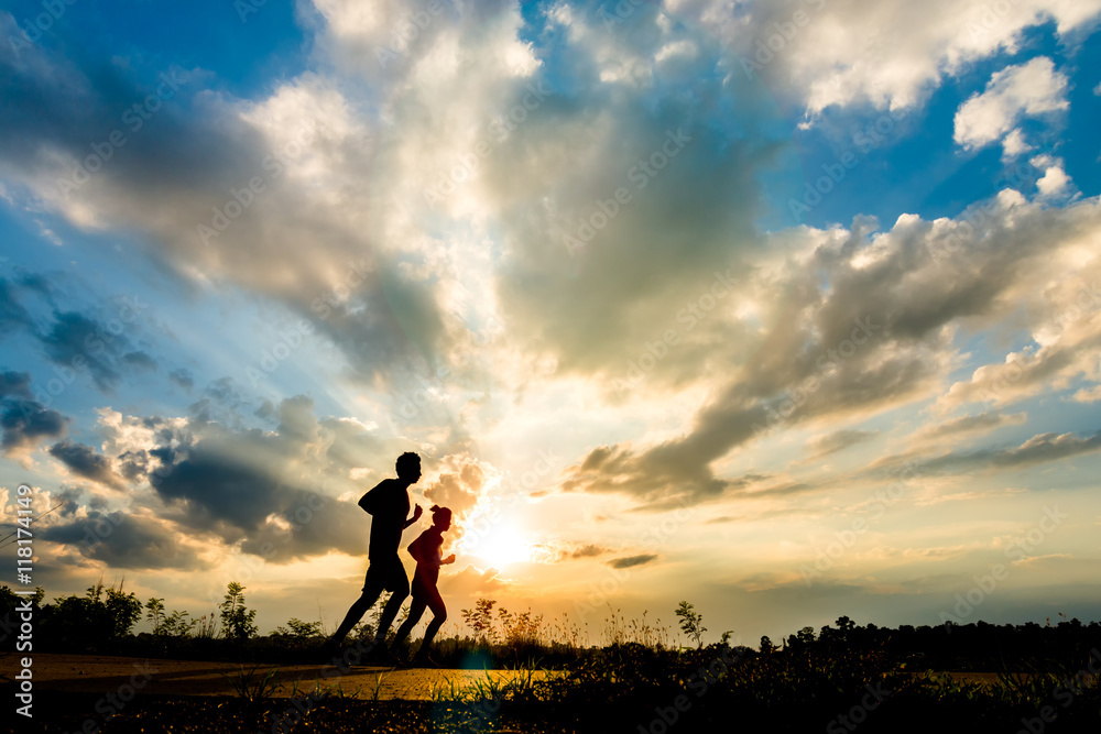 silhouette man jogging on the sunset background