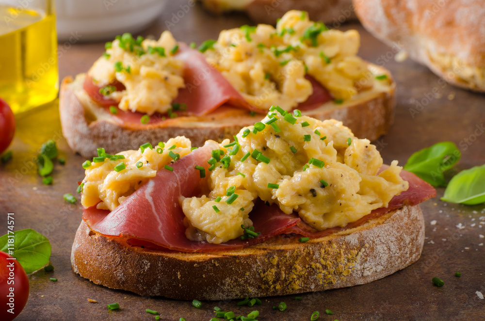 Delicious toasted bread with scrambled eggs Delicious toasted bread with scrambled eggs