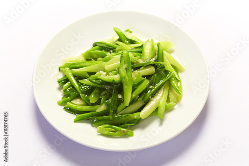 stir fried Chinese broccoli in plate on white background photo