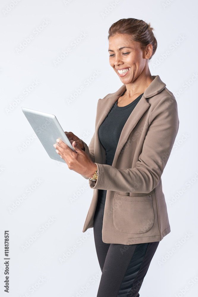Portrait of mixed race business woman holding tablet device Portrait of mixed race business woman holding tablet device