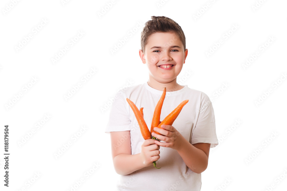 funny boy showing a carrot on a white background in the studio, funny boy showing a carrot on a white background in the studio,
