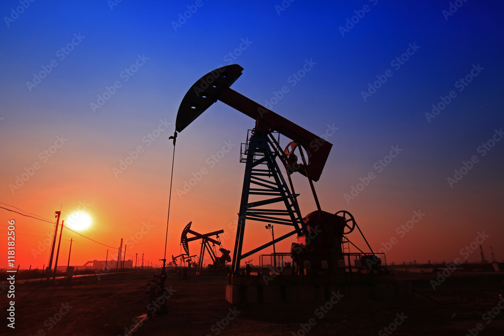 Sunset time of oil pump, oil industry equipment