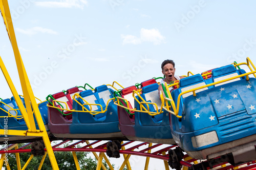 Happy teenager in an amusement park