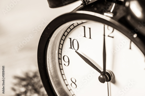 Retro vintage clock on sack closeup at 10 o'clock photo