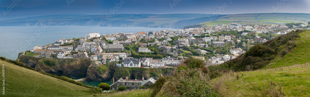 Panoramic view of Port Isaac in northern Cornwall. View from the coast path approaching from the west of the village.