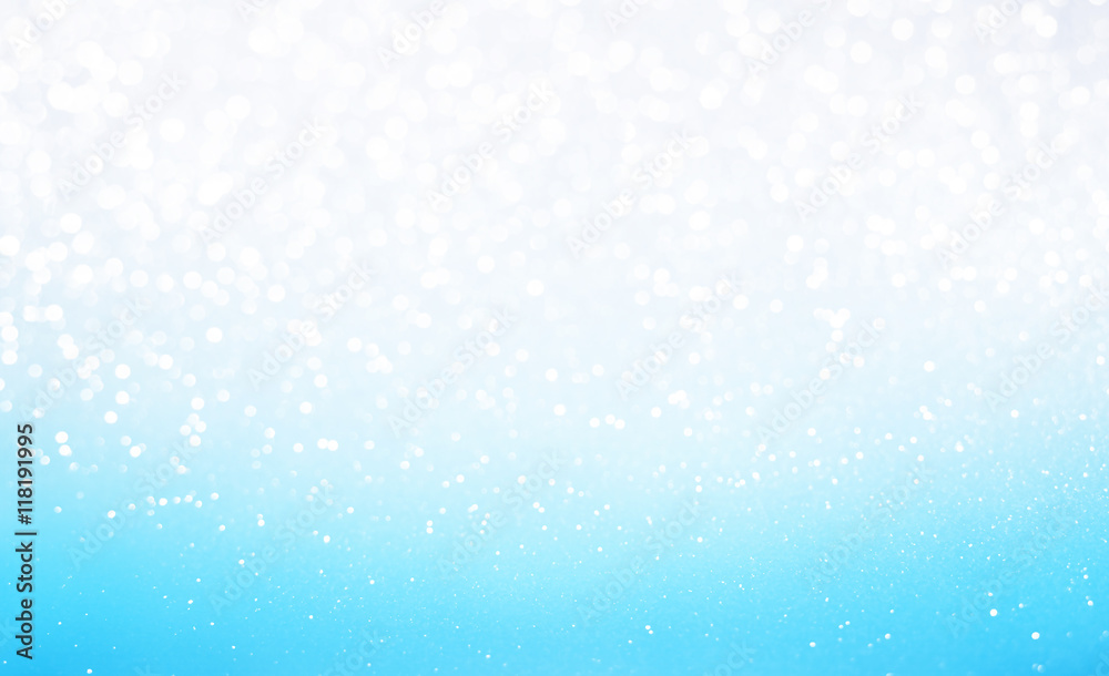 Gradient white and blue glitter bokeh texture background
