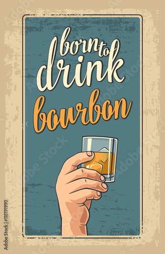 Male hand holding a glass with bourbon and ice cubes.