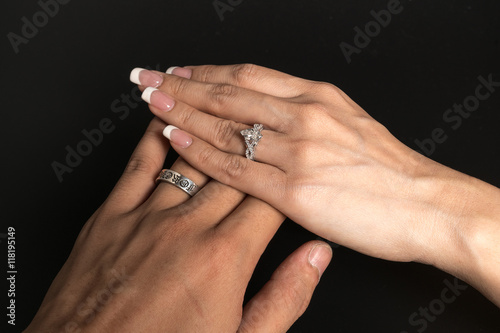 Bridal Couple showing of their wedding rings 