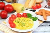 Breakfast of scrambled eggs, baguettes  & vegetable 