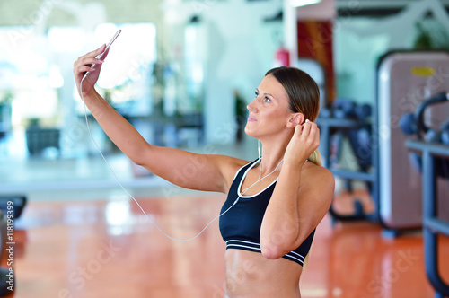 Beautiful young women taking a selfie during a break on a pole fitness class © FS-Stock