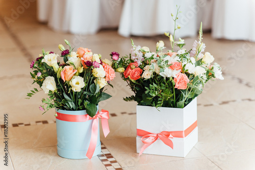 Two beautiful bouquet of bright flowers in basket