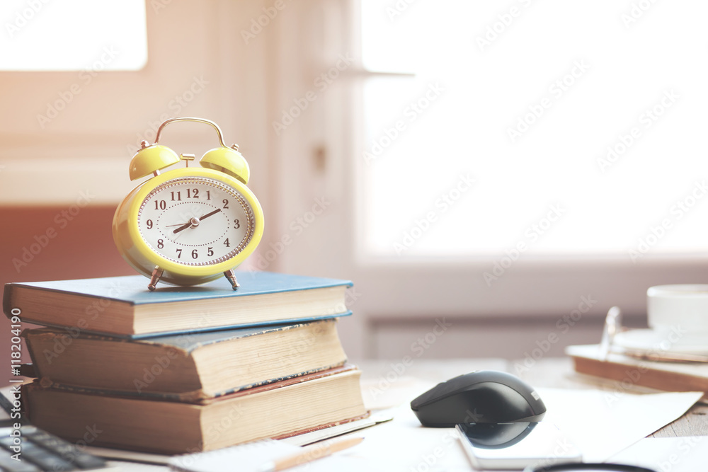 Alarm clock on books Alarm clock on books