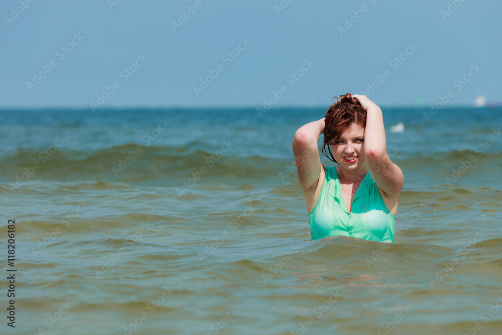 Sensual girl wet cloth in water on the coast. Sensual girl wet cloth in water on the coast.