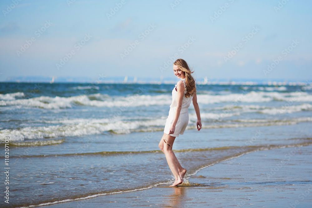 Young woman enjoying her vacation by sea Young woman enjoying her vacation by sea