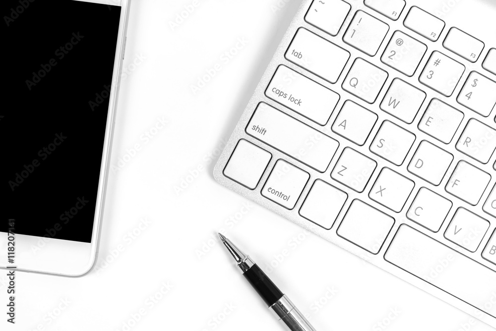 Top view of blank smart phone, keyboard and pen on white background. Top view of blank smart phone, keyboard and pen on white background.