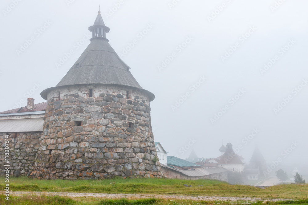 Solovki. Solovetsky Kremlin on the shore of the bay of Wellbeing in the morning mist 