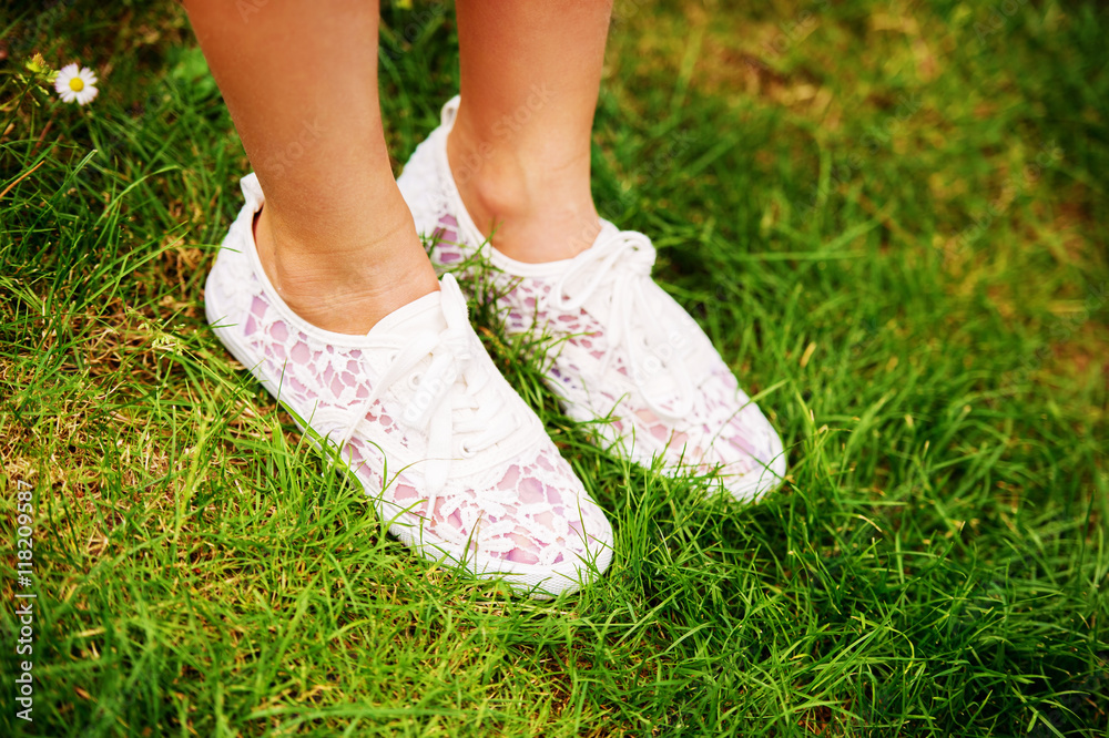 Fashion white shoes on kid's feet
