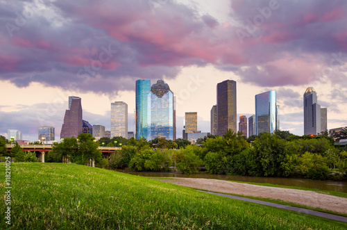 Houston Texas skyline at sunset twilight from park lawn
