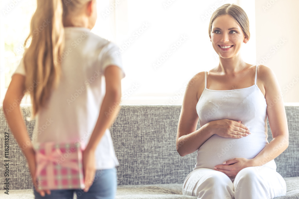 Pregnant woman with daughter Pregnant woman with daughter