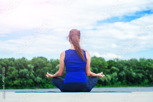 young woman practicing advanced yoga02