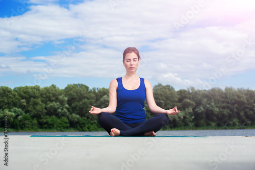 young woman practicing advanced yoga01