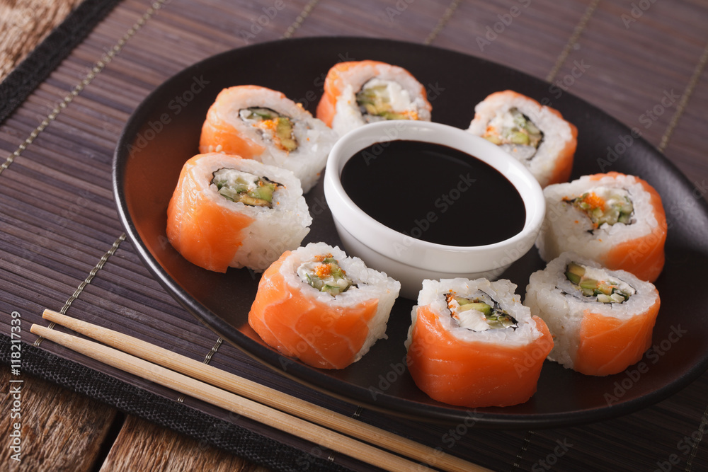 Uramaki. Philadelphia roll classic. Salmon, cheese, cucumber, avocado, tobiko.
Uramaki. Philadelphia roll classic. Salmon, cheese, cucumber, avocado, tobiko.