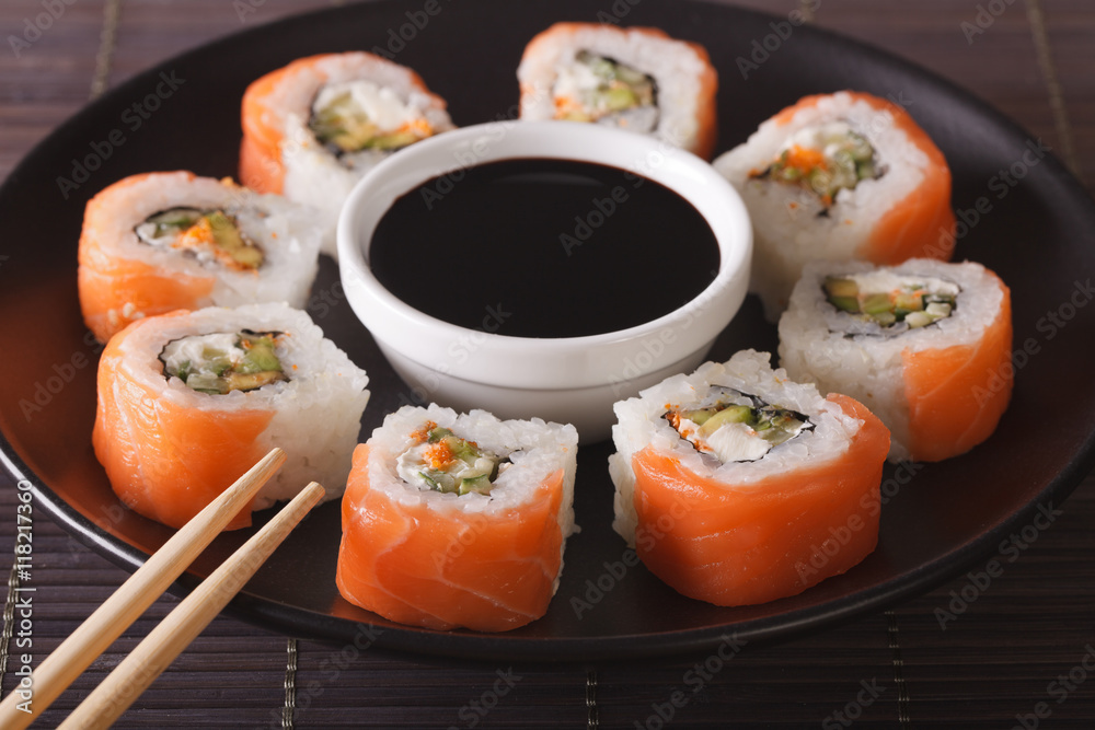Sushi roll philadelphia and soy sauce, closeup. Horizontal
