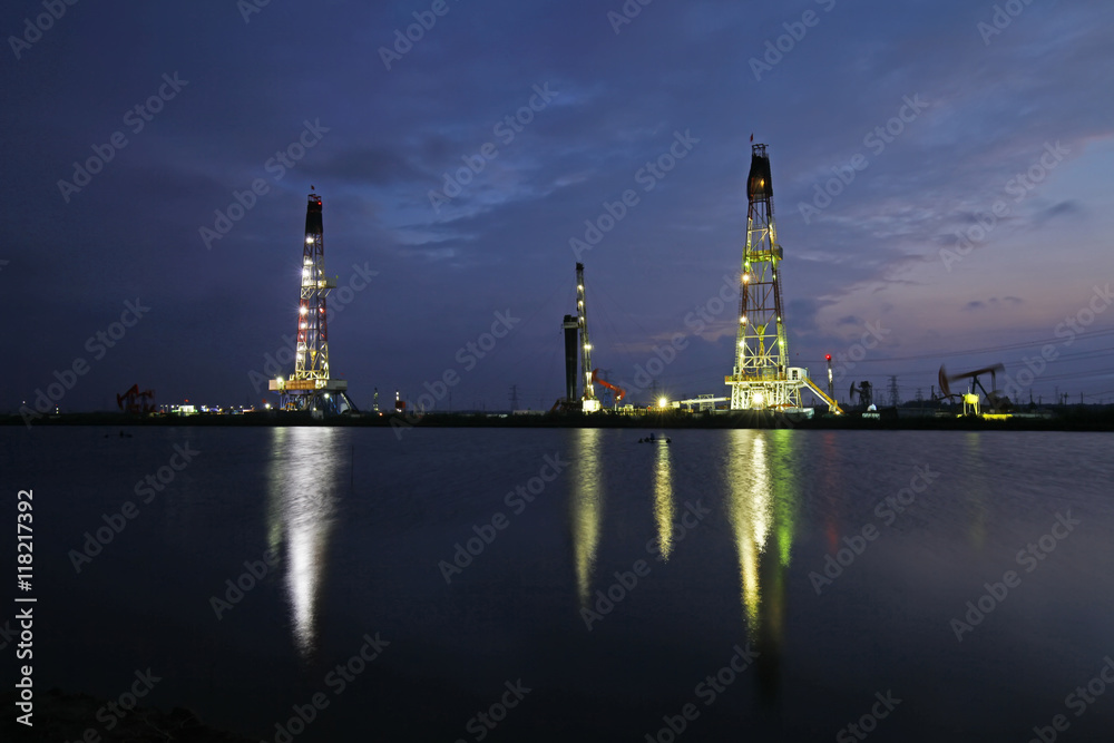 Oil drilling rig in the evening