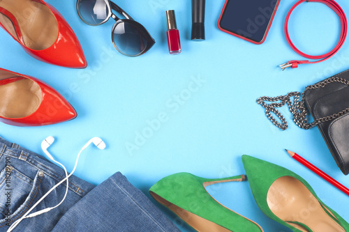 Women accessories and different shoes on light background. Top view.