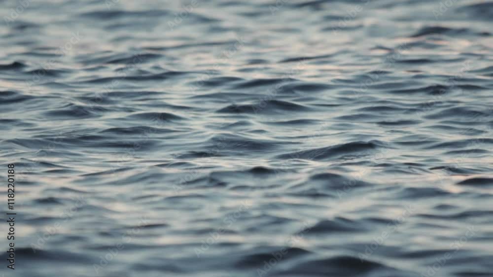 Calm tranquil sea surface telephoto 100p slowmotion.100fps shot of the surface of calm sea waves at almost eye level