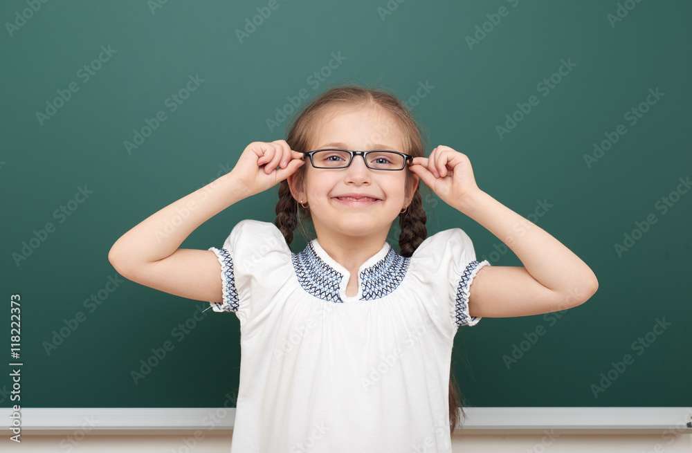 school student girl posing at the clean blackboard, grimacing and emotions, dressed in a black suit, education concept, studio photo school student girl posing at the clean blackboard, grimacing and emotions, dressed in a black suit, education concept, studio photo