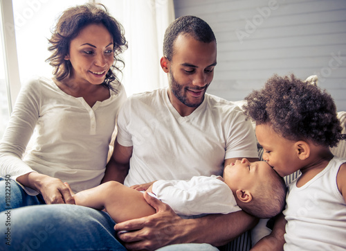 Family sitting on couch photo