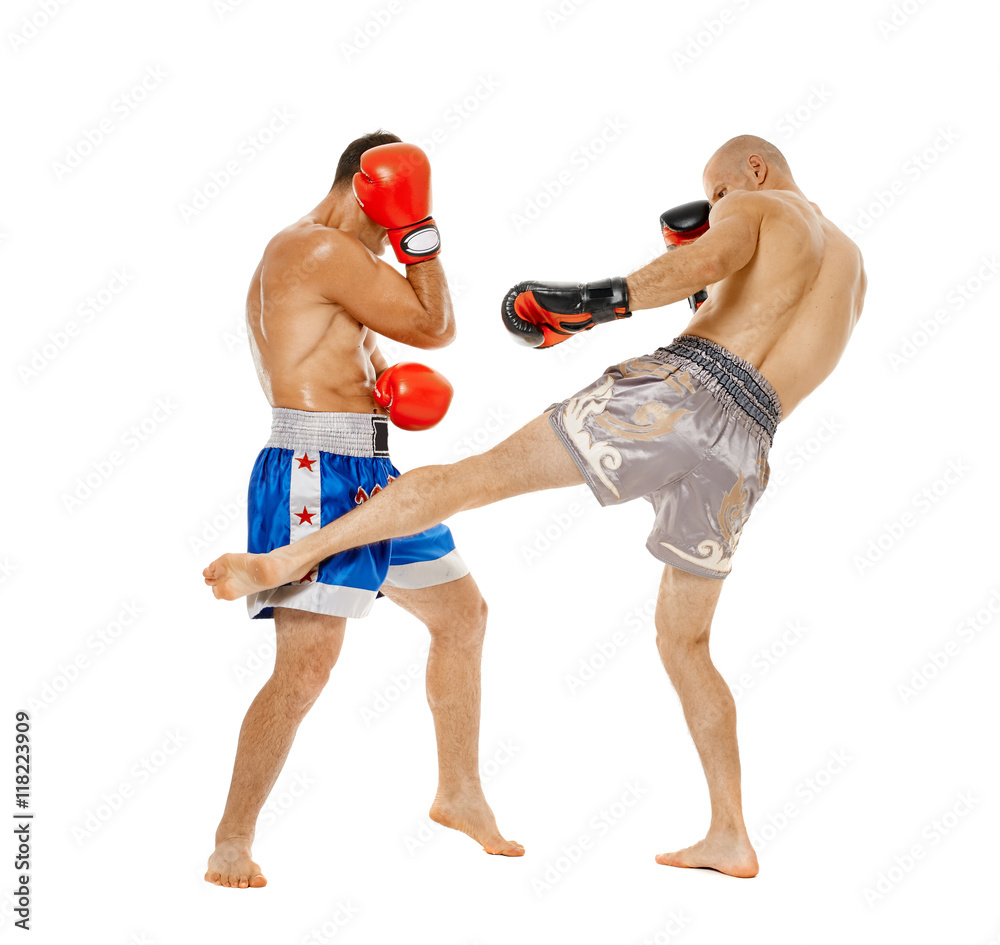 Kickboxers sparring on white