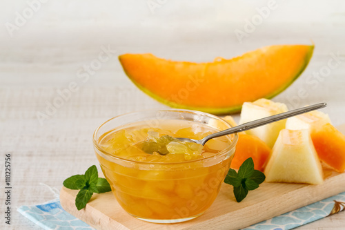 Cantaloupe melon jam in a glass bowl on a table