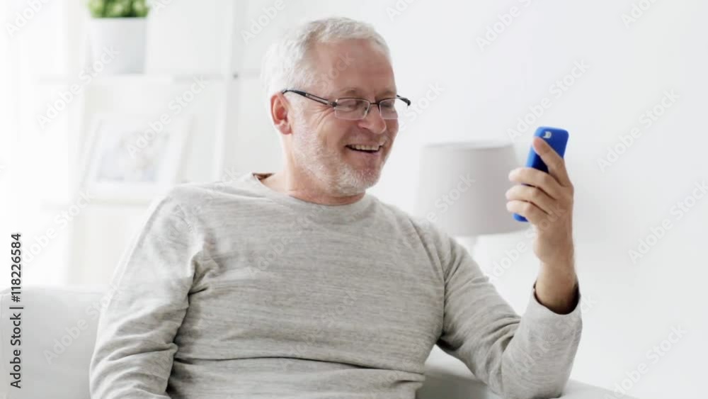 senior man having video call on smartphone at home 126 senior man having video call on smartphone at home 126